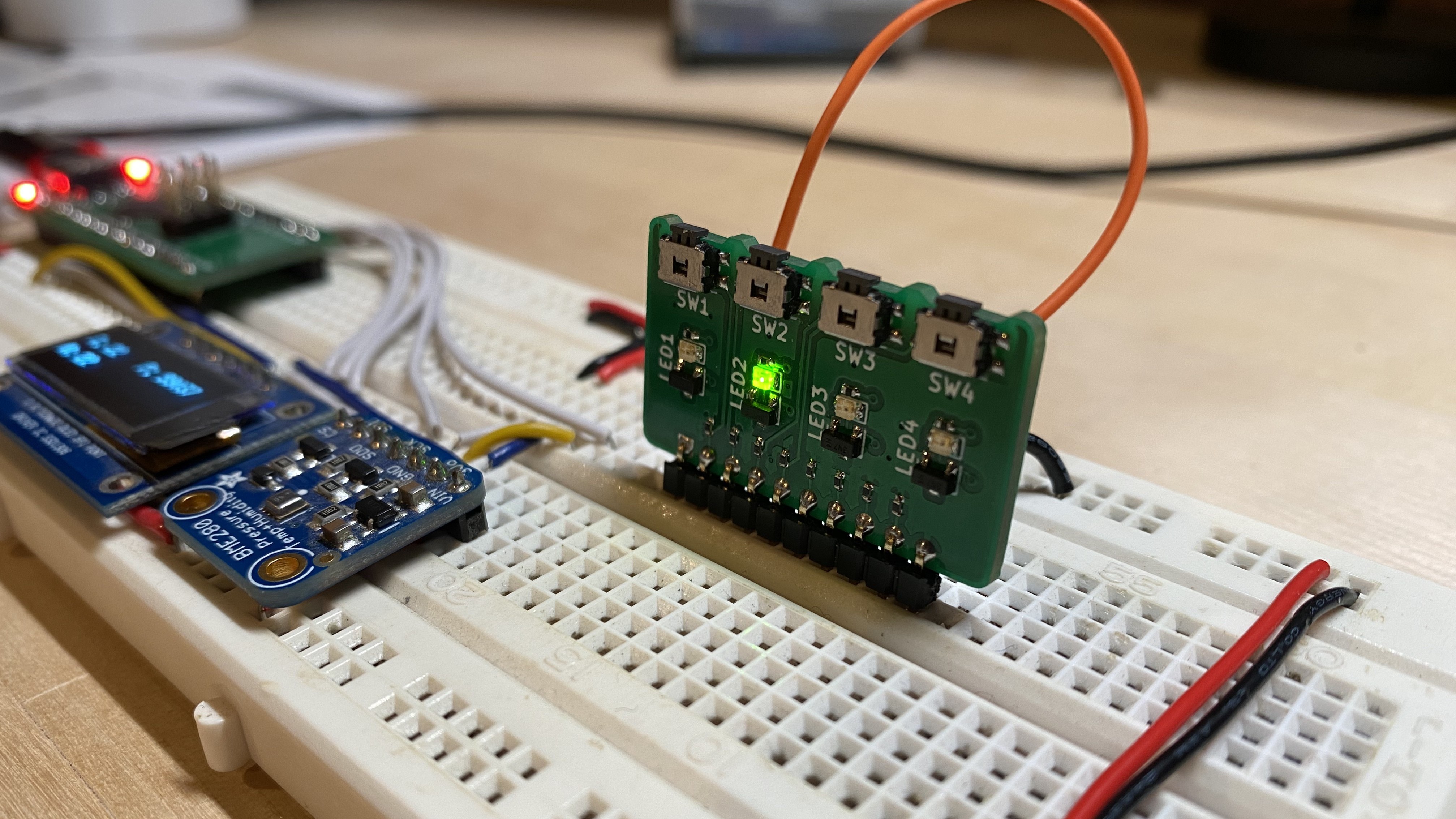 breadboard-io inserted into a breadboard with the second LED turned on